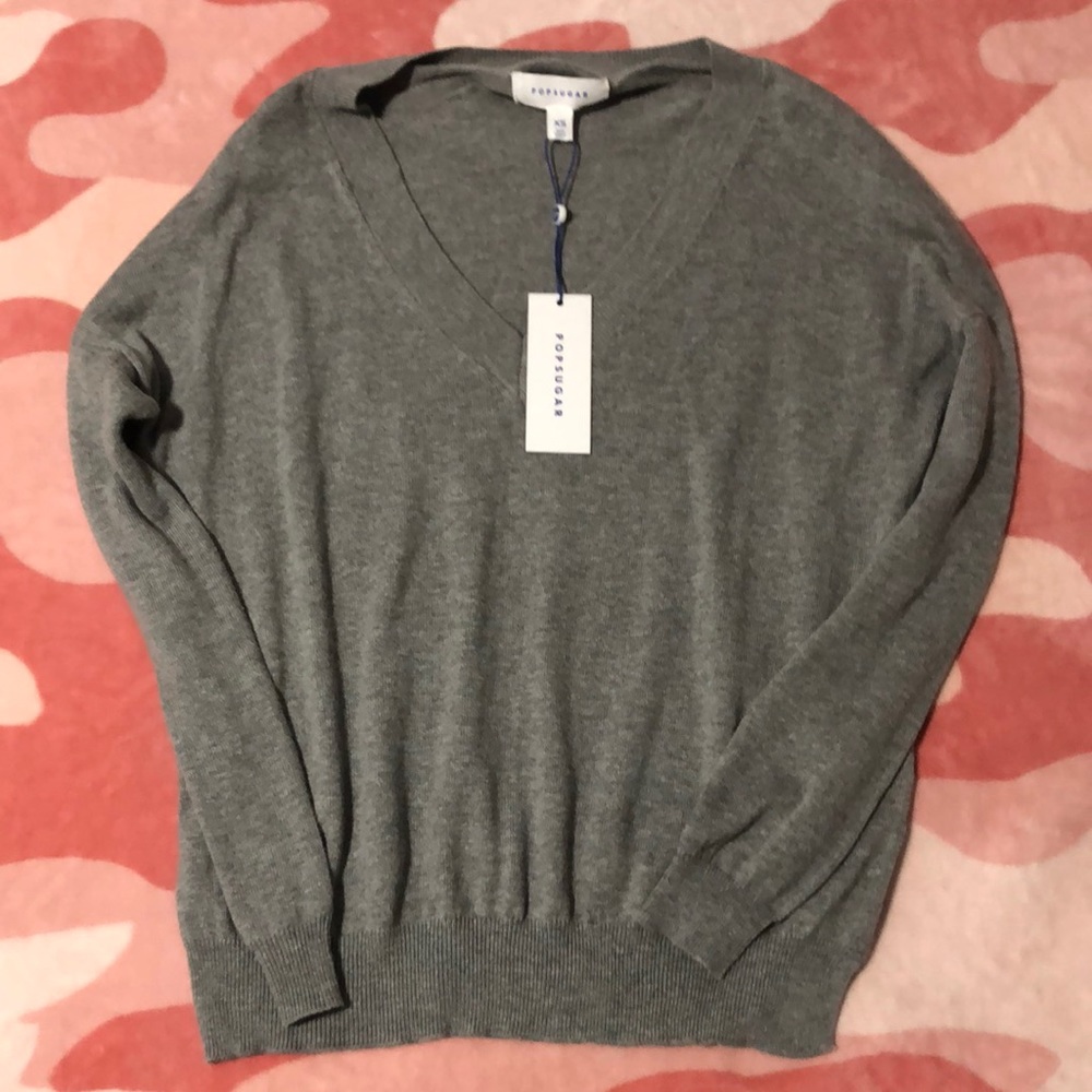 This is a Heather gray sweatshirt. It is a size XS in Women and it stretches.